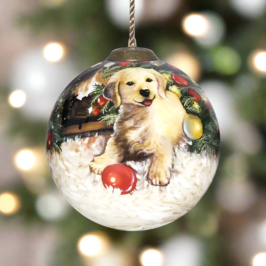 Nothing says Christmas like a puppy under a decorated tree. So we are happy to carry the Dona Gelsinger Christmas Puppy Ornament by Inner Beauty