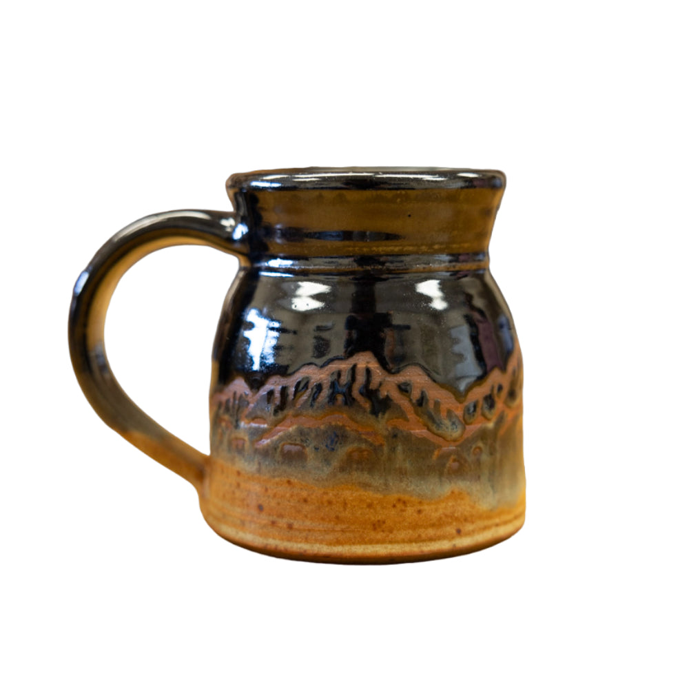 Having homemade kitchen and dishware really elevates your kitchen, that's why we love the Black No Spill Mug by Fire Hole Pottery