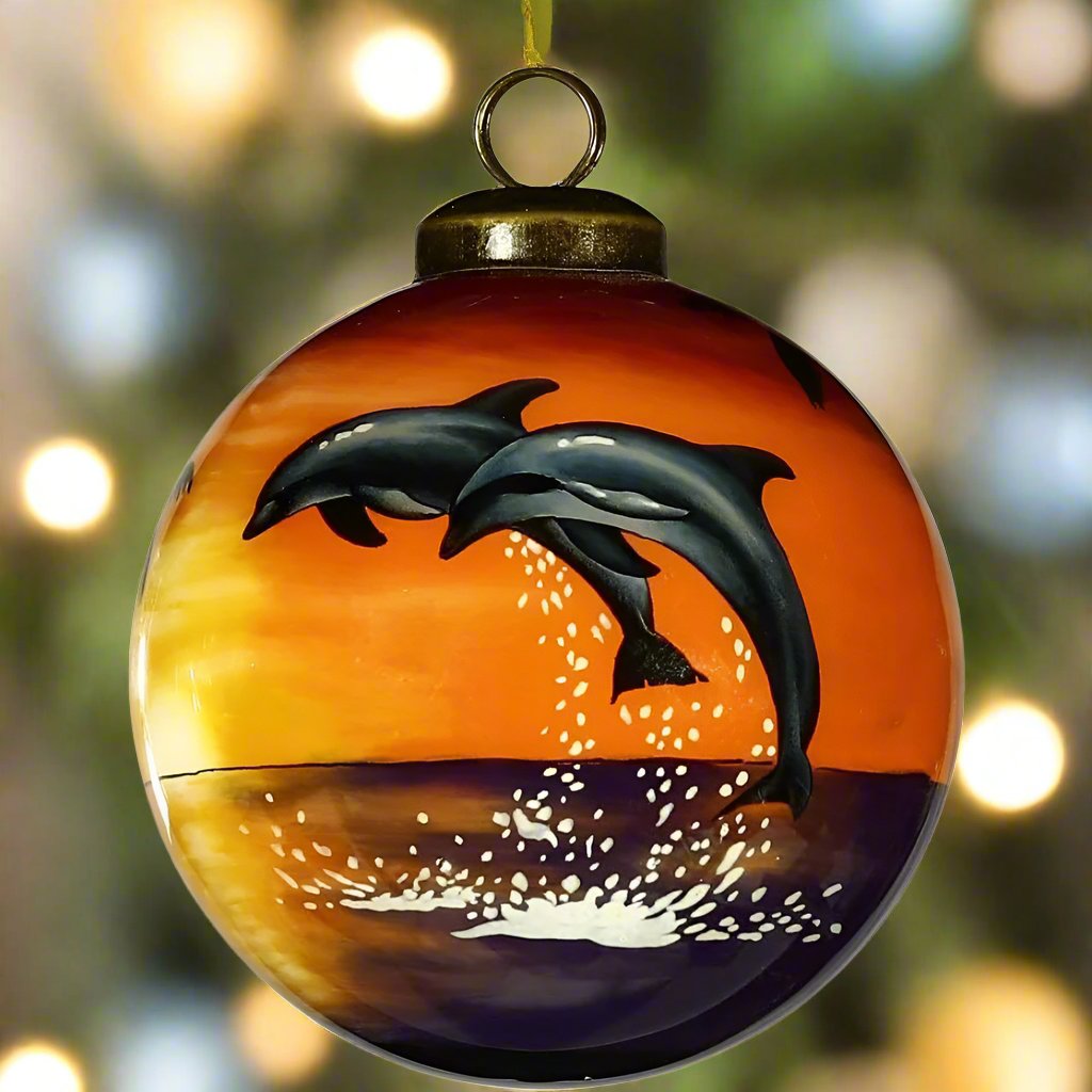 Decorating the Christmas tree doesn't have to always reflect the weather. Instead,  brighten up your tree and remind yourself of warmer days with the Sunset Dolphin Ornament by Inner Beauty. 