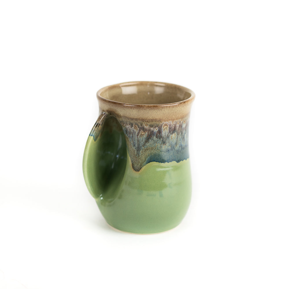 https://www.giftcorral.com/cdn/shop/products/MT_Meadow_Left_handed_mug_by_Clay_in_Motion_75826.jpg?v=1608143505