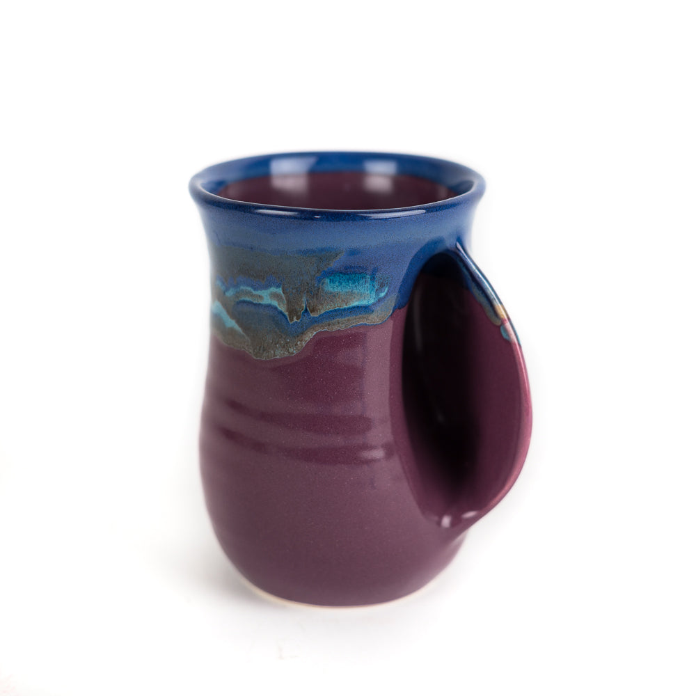 https://www.giftcorral.com/cdn/shop/products/Purple_Passion_right_handed_mug_by_Clay_in_Motion_75820_1024x.jpg?v=1608143620